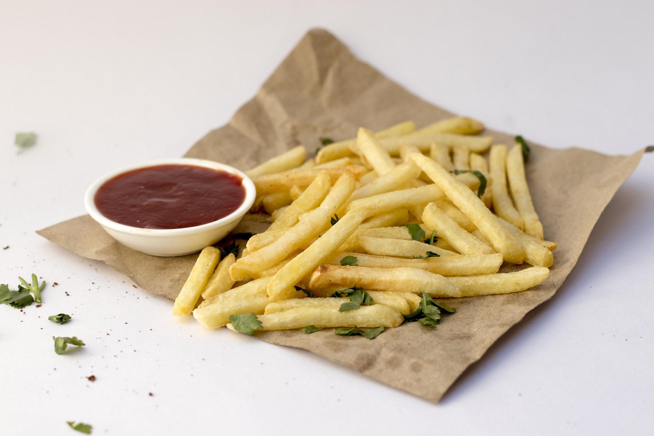 Fries on a napkin with ketchup